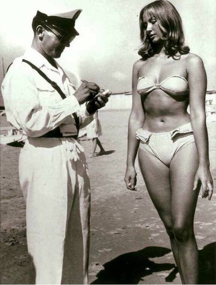 A police officer writes a ticket for a woman walking in a bikini. Italy 1957 - Story, Bikini, Italy, Swimsuit, , Fashion