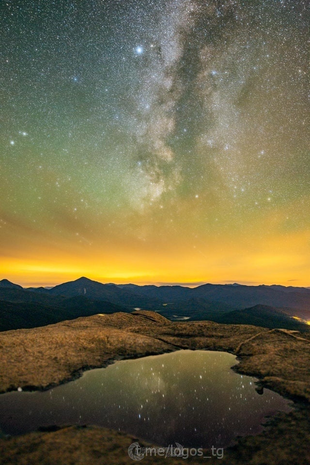 On Cascade Mountain during the Perseid rain hoping to capture the meteors. I turned the camera towards the Milky Way and its reflection flickered - Milky Way, The photo