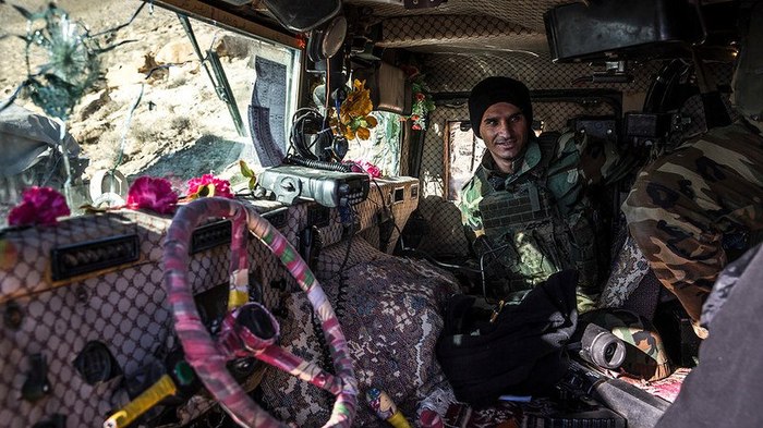 Kurdish Peshmerga fighters inside one of the armored vehicles... - Armored car, Interior, Kurds, Peshmerga