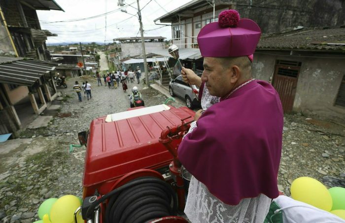 A Catholic priest suggests dousing the city with holy water to get rid of street gangs and drugs. - Colombia, Priests, Holy water, Crime, Exorcism