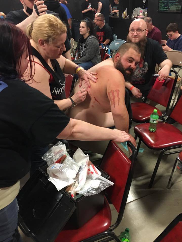 A fan stitches up a cut to Mike Roach at IWA MS King of the Deathmatches 2018. - , , Wrestling, Fans