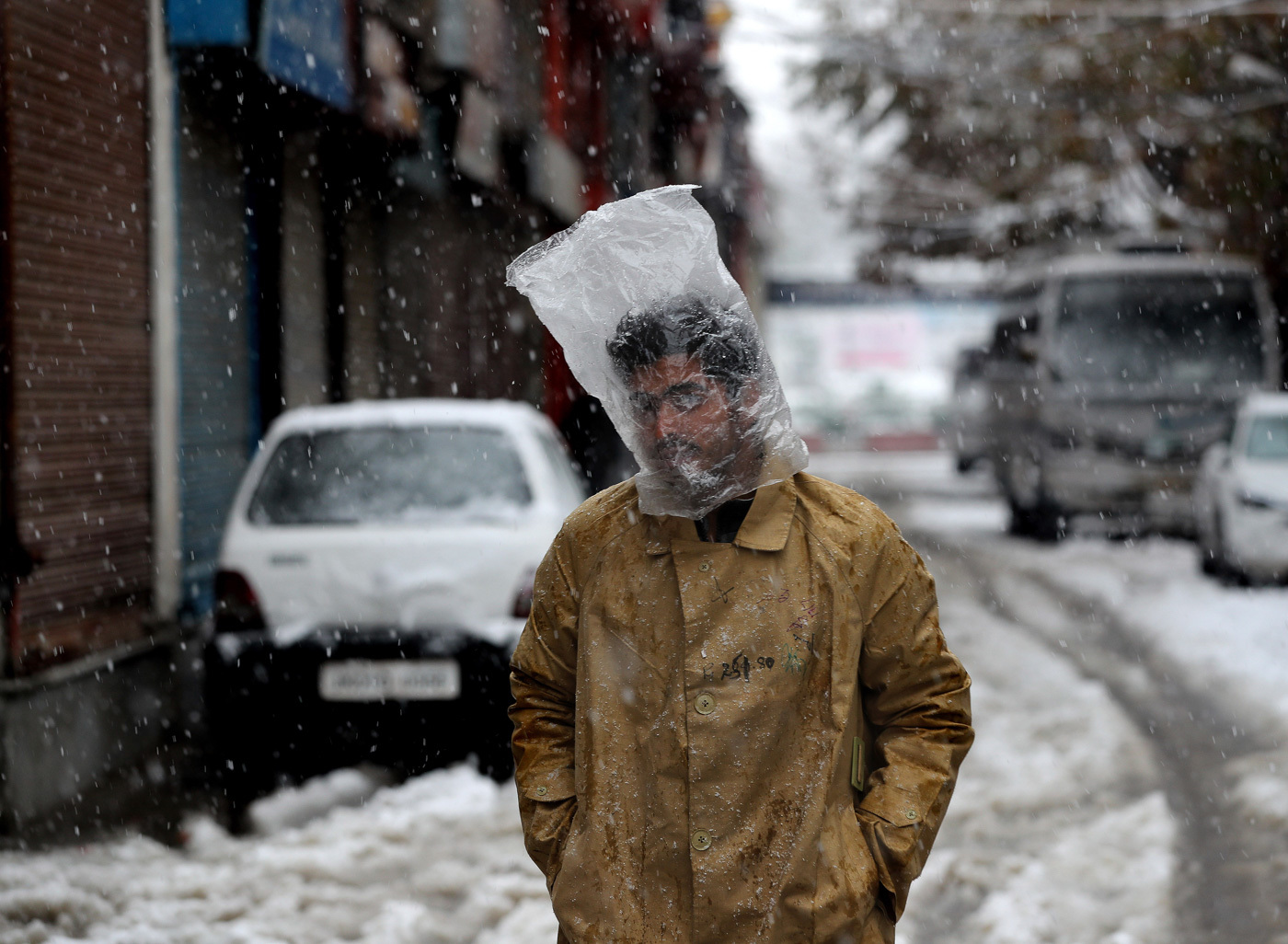 First snow, India, 2019 - India, Kashmir, Snowfall, Town, The street, Men, Pack on the head